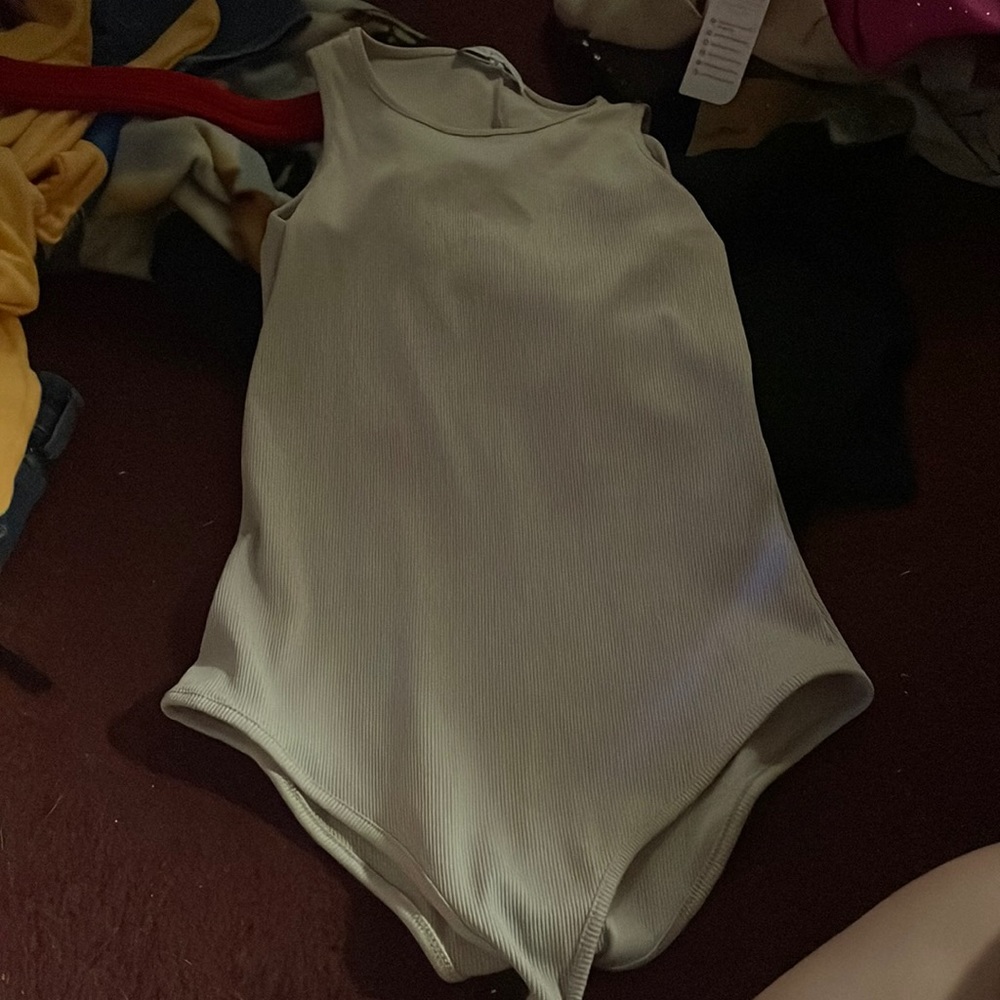 Cream colored bodysuit. Barley worn.